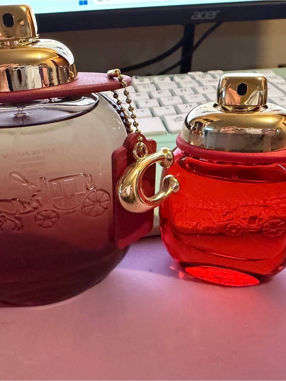 Coach Red Glass Bottle Duo with Gold Accents